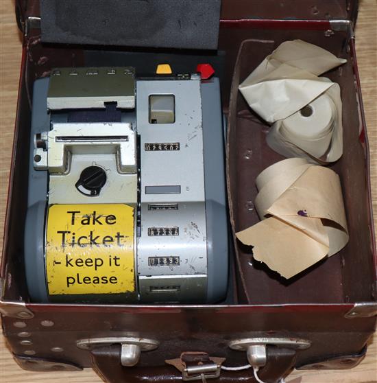 A Gibson A14 London bus ticket machine and a Swedish AB Almex ticket machine, both in fitted leather cases